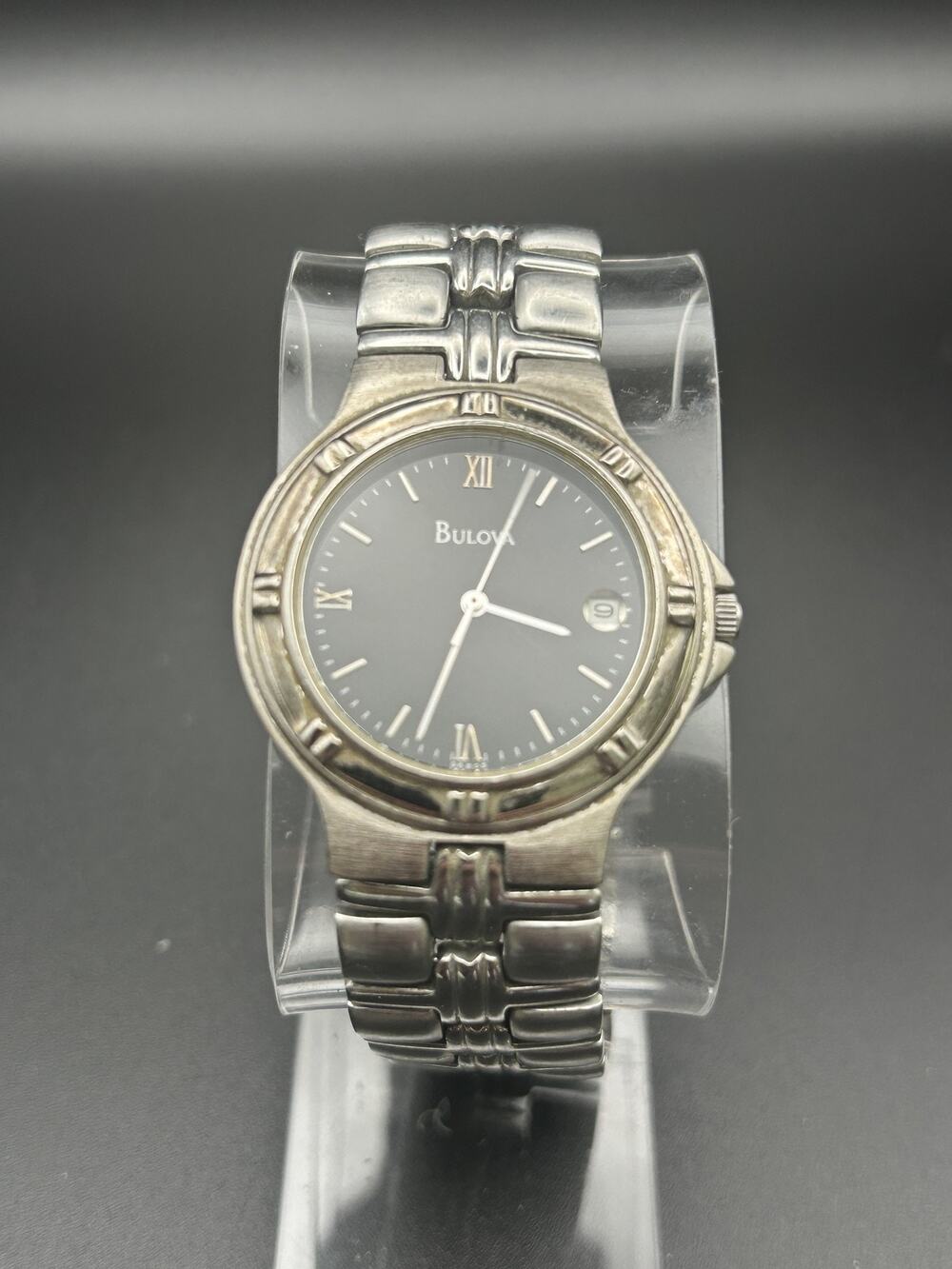 Bulova 96B05 Mens Quartz Watch 32mm Black Dial Roman Numerals Date Silver Tone
